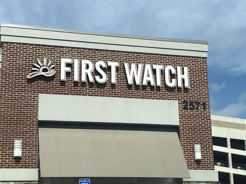 Exterior signage of First Watch restaurant location in Decatur, Georgia, showing the restaurant’s name displayed on the building facade.